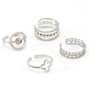 Set of four silver stainless steel rings with clover and geometric adjustable open bands