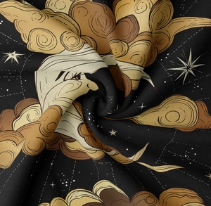 Detail of celestial tapestry fabric showing vintage sun moon print and soft texture