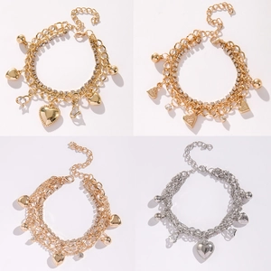 Multilayer chain bracelets with heart charms and crown pendants in gold and silver finish