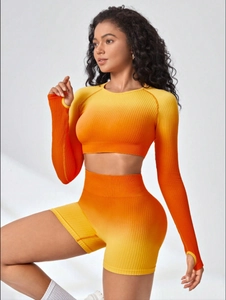 Close-up of ribbed gradient yoga set featuring thumbhole sleeves and high-waist shorts