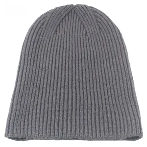 Macro shot of grey ribbed knit texture on a minimalist beanie with fine vertical stripes