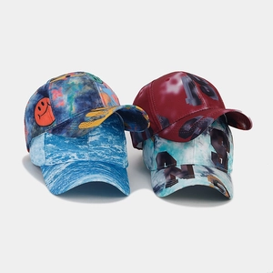 Detail view of four street style baseball caps with diverse digital print patterns
