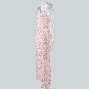 Side view detail of the slim fit floral maxi dress showing pink and yellow flower patterns