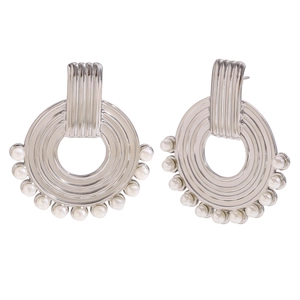 Vintage style silver metal hoop earrings with striped texture and white pearl accents