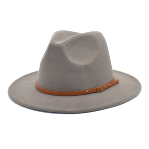 Detailed view of the grey wool jazz fedora featuring a brown leather band and metal buckle