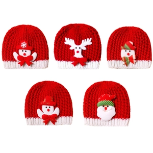 Christmas themed baby knit hats with festive snowman and reindeer cartoon patterns