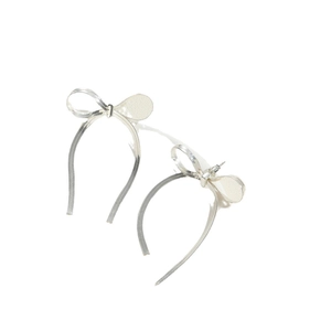 Minimalist silver bow earrings with metal snake chain mesh texture on a white background