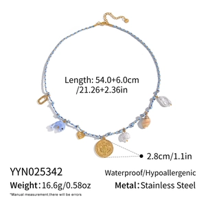 Detail showing stainless steel blue woven necklace with dolphin and shell charms and sizes