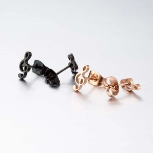 Minimalist musical note stud earrings in black and rose gold finish on a sleek surface