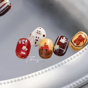 Detail of cartoon bear nail art stickers with glossy finish on oval shaped press-on nails