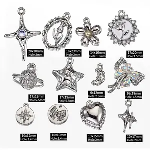 Assorted silver Y2K pendants with cross, heart, and star designs for DIY jewelry making