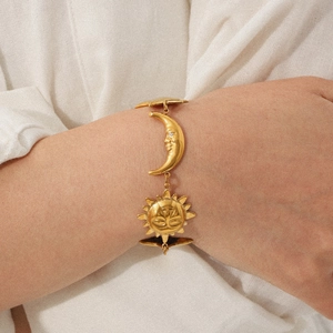 18K gold plated stainless steel sun and moon bracelet shown on wrist for summer beach style