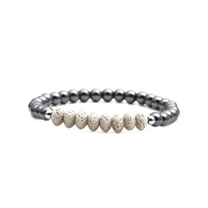 Beaded bracelet with dark grey hematite rounds and white volcanic stone abacus beads