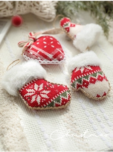 Detailed knit Christmas ornaments with red mittens, hearts, and boots in cozy winter theme