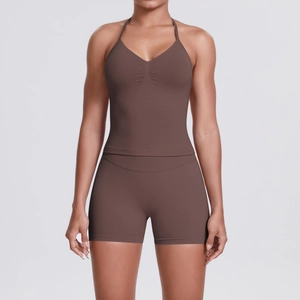 Seamless chocolate brown yoga set with halter neck sports bra and high-waist biker shorts