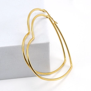 Elegant large golden heart-shaped hoop earrings made of polished titanium steel for women