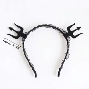Detail of black lace Halloween headband with 5.7cm devil trident horns on white background