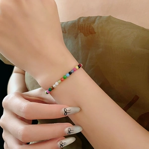 Detailed view of vibrant rainbow beaded bracelet with high-quality colorful natural stones