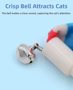 Detail of metal bell and colorful plush feathers on cat wand for interactive play