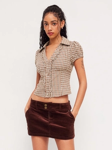 Retro brown plaid short sleeve shirt with ruffle collar and brown corduroy mini skirt