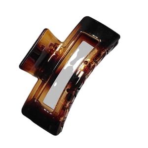 Classic amber tortoiseshell large rectangular hair claw clip for women on white background