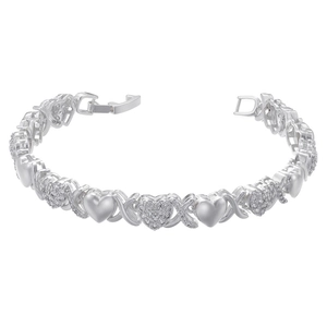 Macro shot of silver XOXO link bracelet with pavé heart charms and jewelry clasp