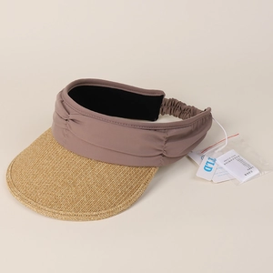 Close-up of the woven straw brim and elastic band on the pleated sun visor hat