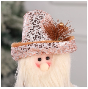 Close-up of a Christmas gnome plush with rose gold sequins and white faux fur details