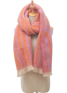 Detail shot of orange and pink striped scarf with fringe texture on a mannequin
