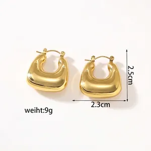 Detail view of 2.5cm gold U-shaped chunky hoop earrings showing exact dimensions and weight