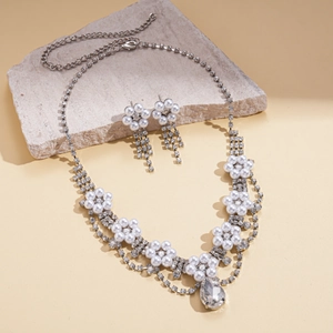 Elegant two-piece jewelry set with pearl flower necklace and pear-cut crystal pendant