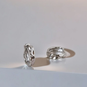 Irregular textured S925 sterling silver hoop earrings with a vintage minimalist design