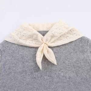 Grey knit sweater featuring a stylish scarf-inspired lace collar and golden ring detail