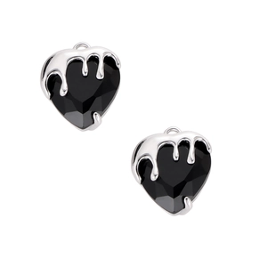 Detail of silver melting heart pendant with faceted black gemstone in gothic style
