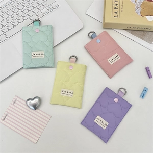 Detailed view of quilted heart card holders in pastel green pink yellow and purple