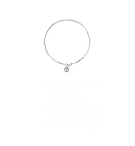 Macro detail of silver snake chain bracelet featuring a bezel-set round crystal stone