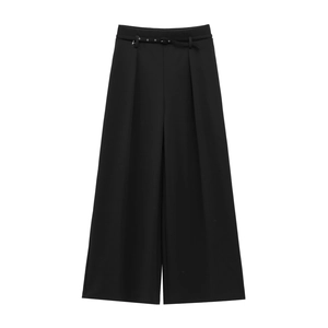 Detail of high-waist black wide-leg trousers featuring a slim matching decorative belt