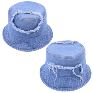 Detail showing distressed light blue denim bucket hat with ripped holes and frayed edges