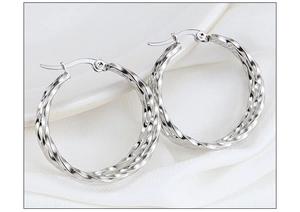 Detailed view of silver twisted rope texture on stainless steel hoop earrings