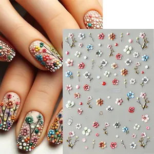 Detail of 5D embossed nail stickers featuring white and yellow daisies and dots