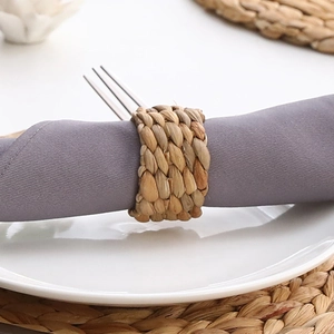 Detailed close-up of a handmade round water hyacinth napkin ring with natural weave texture