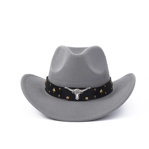 Detail of grey felt cowboy hat featuring black leather band and silver bull head ornament