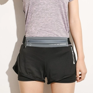 Detail of gray waterproof running belt with headphone port and zipper on model