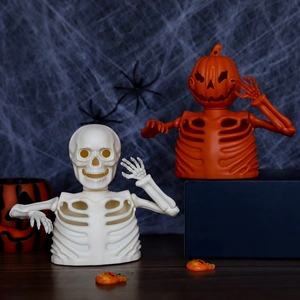 Halloween skeleton and pumpkin bust candle holders for festive party table decoration