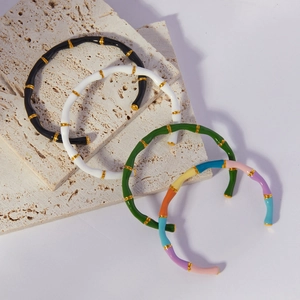 Bamboo style enamel open cuff bracelet with gold accents in multiple vibrant colors