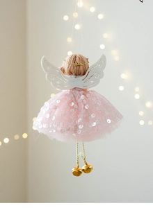 Detailed view of Christmas angel hanging ornament with pink sequin mesh dress and bells