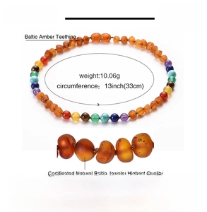 Detail of 33cm Baltic amber teething necklace with colorful beads and N0017 sizing info
