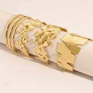 Set of four 18K gold plated C-shaped stainless steel bangles with textured patterns