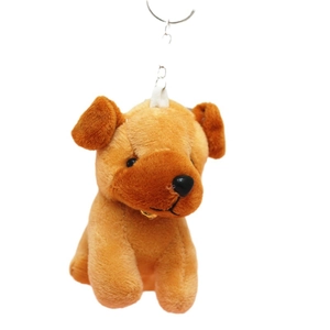 Brown plush puppy toy keychain with metal bell on white background for bag charm