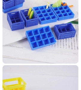 Detailed close-up of miniature blue and yellow crates for dollhouse and DIY scenes